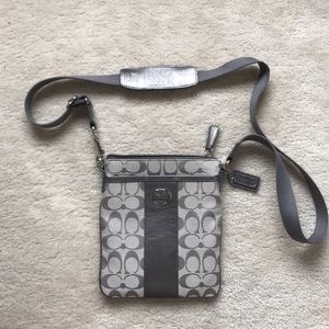 Gray silver Coach crossbody.